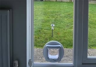 Glass door cat flap installation